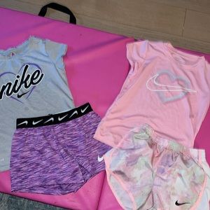 Two Nike size 6 short sets